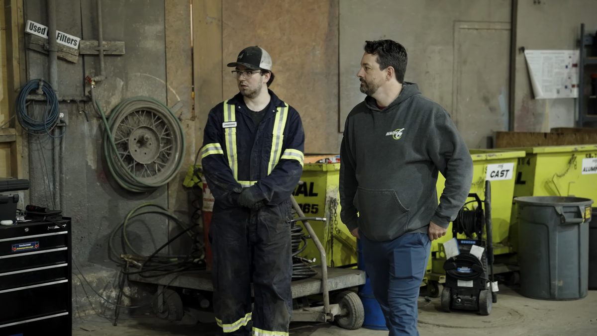 Josh Langstaff talking with a technician on the Mach 6 shop floor